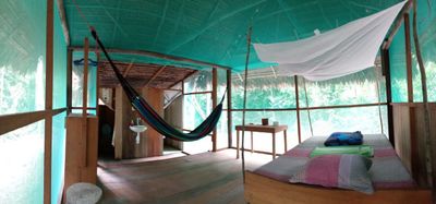Inside a private tambo on the grounds of El Centro Inka Meraya. Inside there is a bed, private bathroom and hammock.