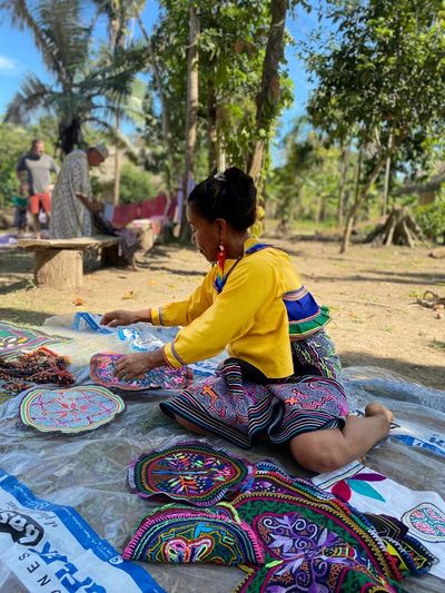 Shipibo woman with traditional Peruvian stitching on the grounds of El Centro Inka Meraya.